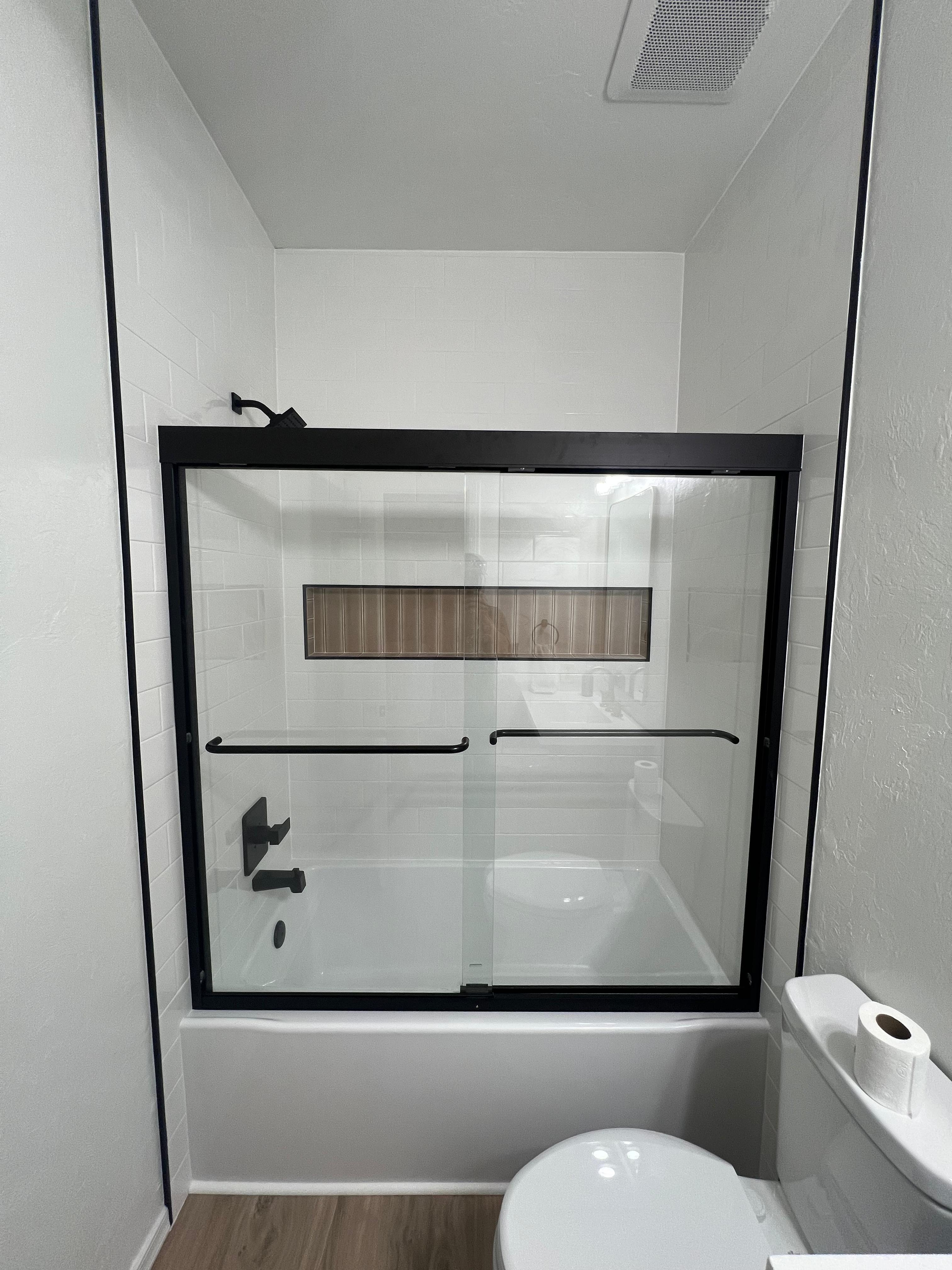 Bathroom renovation with sliding glass door