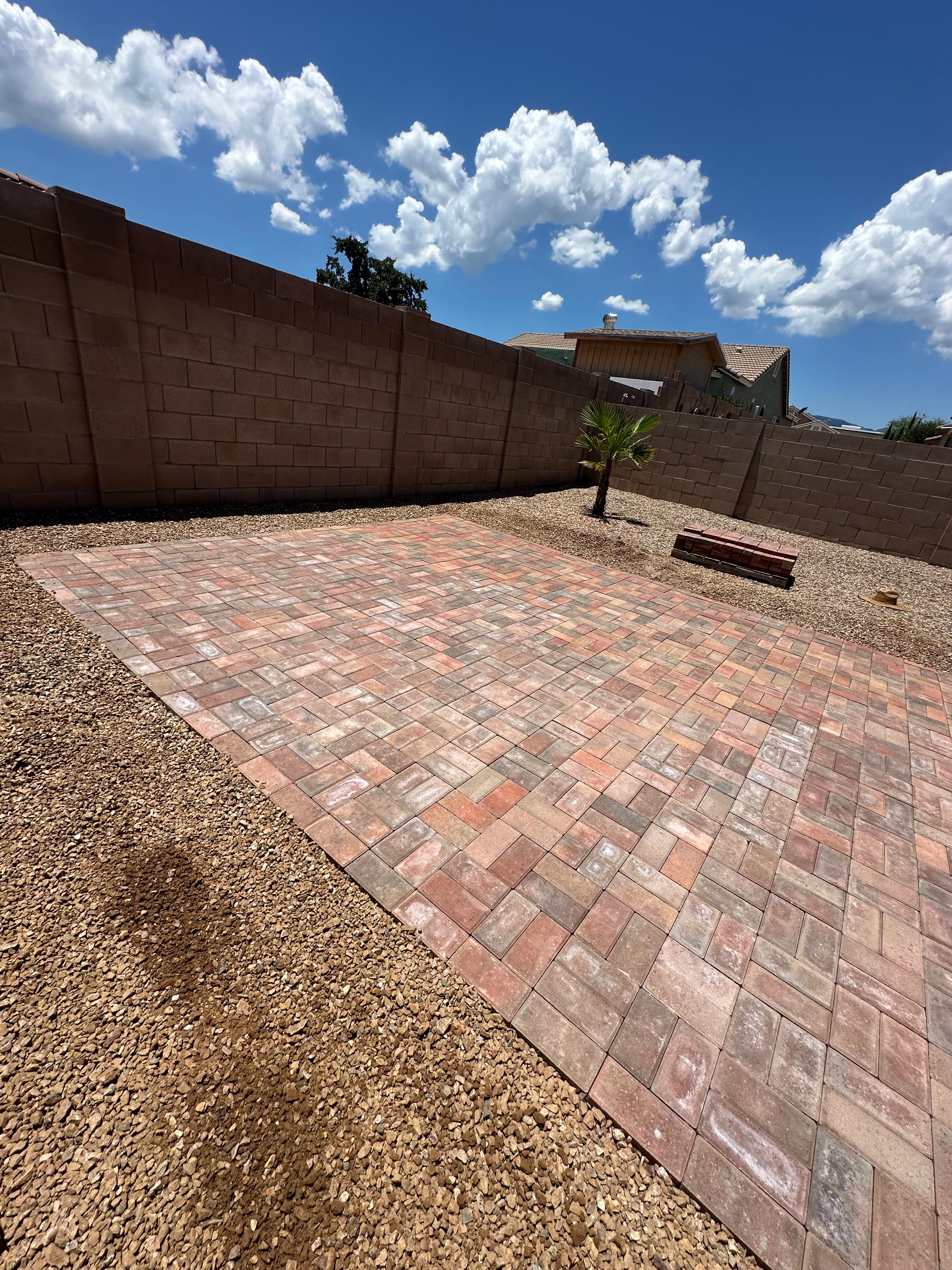 Paver patio installation in backyard